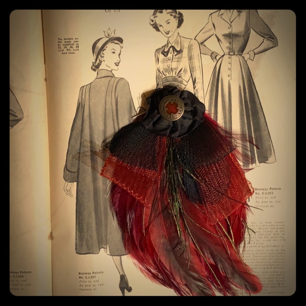 Red feather hair accessory